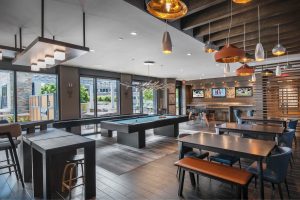 The ultimate hangout with HDTV sports wall, kitchen, billiards, shuffleboard, and foosball
