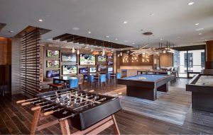 Relax and kick back in clubroom with HDTV sports wall, kitchen, billiards, shuffleboard, and foosball